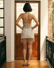 FJØRNA white beaded sequin mini dress with embellishments, perfect for cocktail events, shown on a model.