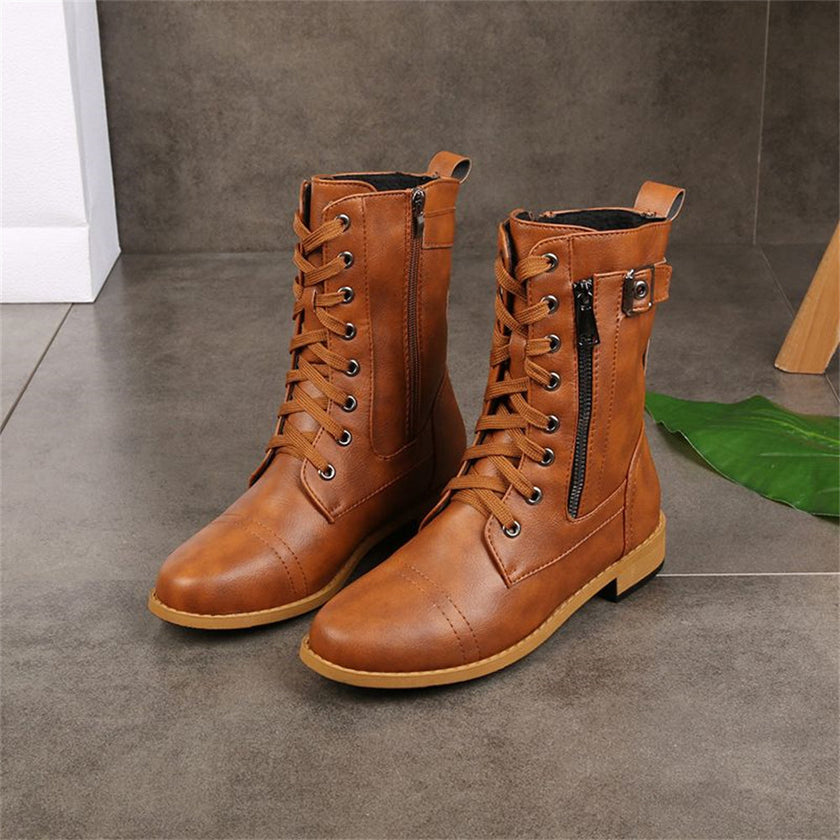 FJØRNA women's orthopedic boots with adjustable straps and zip-up closure, black support footwear for comfortable wear.