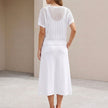 FJØRNA women's knit cropped two-piece set shown from the back, featuring fitted top and high-waisted bottoms in a stylish co-ord design.