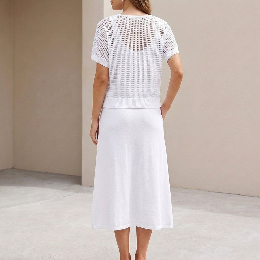FJØRNA women's knit cropped two-piece set shown from the back, featuring fitted top and high-waisted bottoms in a stylish co-ord design.