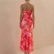 Back view of FJØRNA elegant one-shoulder maxi dress for women, showcasing its fitted bodycon style and stylish back detail.
