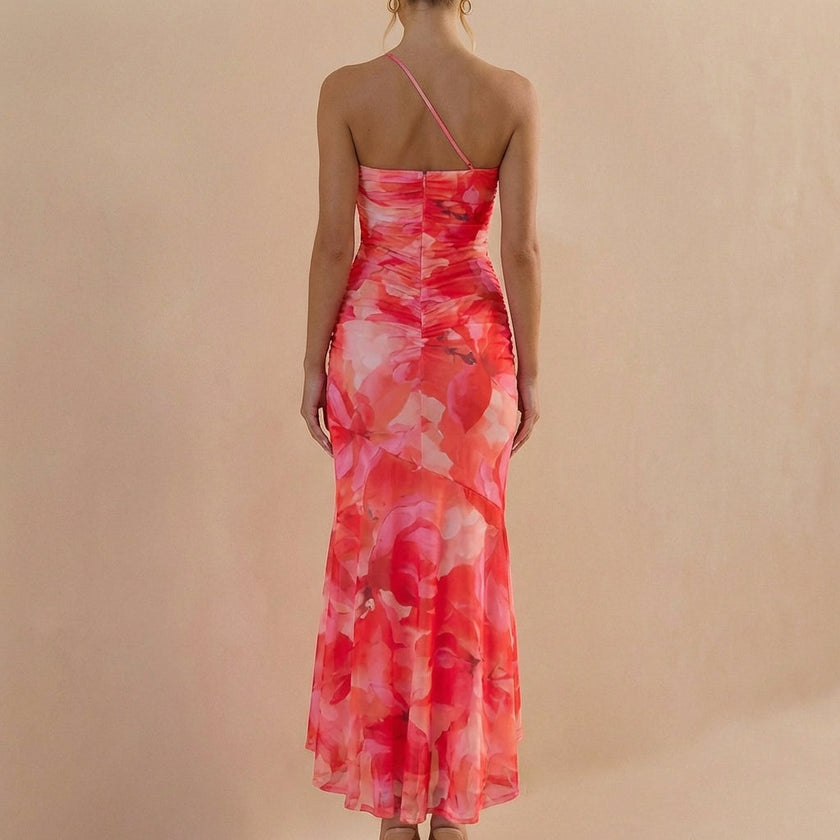 Back view of FJØRNA elegant one-shoulder maxi dress for women, showcasing its fitted bodycon style and stylish back detail.