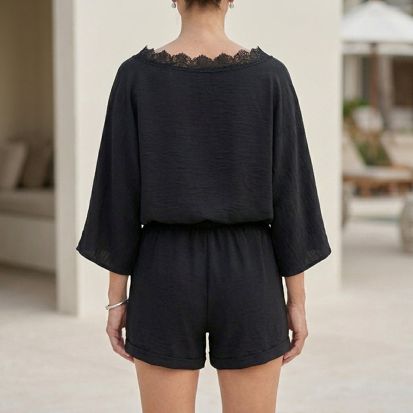 Back view of FJØRNA women's elegant two-piece lace co-ord set with pockets, featuring a Bardot neckline.
