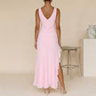 FJØRNA elegant women's maxi dress with V-neck and sleeveless design, shown from the back view. Perfect for summer occasions.