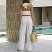 FJØRNA women's summer two-piece set with pockets, halter neck, and back view, stylish co-ord outfit for warm weather.