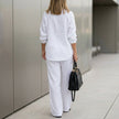 FJØRNA women's summer two-piece co-ord set with drawstring waist, relaxed fit, shown from the back in a casual outdoor setting.