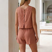 FJØRNA women's summer two-piece co-ord set with pleated design, shown from the back on a model.