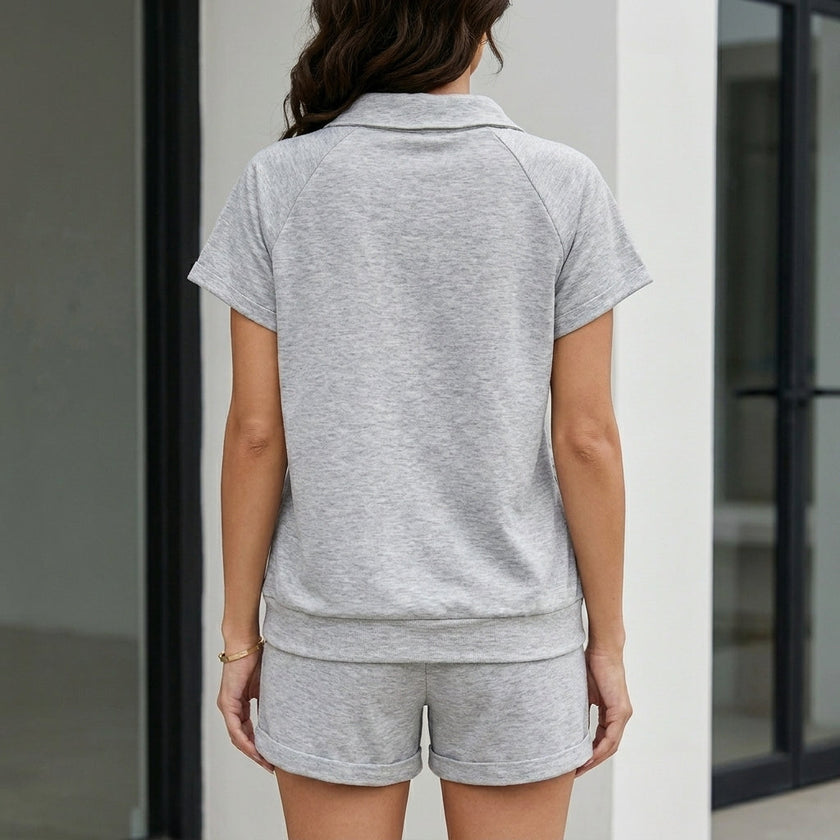 FJØRNA women's summer two-piece co-ord set with V-neck top and matching pants, featuring side pockets, shown from the back.