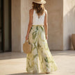 FJØRNA women's floral two-piece set with wide-leg pants and halter neck, shown from the back, stylish and elegant co-ord outfit.