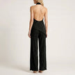 Elegant two-piece women's co-ord set with pleated design and halter neck, styled from the back, by FJØRNA.