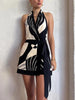 FJØRNA backless wrap-front women's mini dress showcasing a stylish party and day wear design with a fitted silhouette.