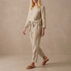 Beige women's linen two-piece co-ord set with pockets from FJØRNA, featuring a stylish and comfortable matching top and pants.