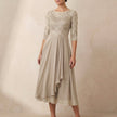 Beige FJØRNA elegant midi bodycon chiffon dress for women, featuring a fitted silhouette and flowing fabric.