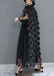 FJØRNA black tulle party dress with o-neck, asymmetrical hem, half sleeves, suitable for evening events.