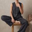Black FJØRNA women's linen two-piece pleated co-ord set, stylish and elegant for sophisticated casual wear.