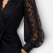 Women's black lace midi dress with elegant slim fit and lace sleeves, perfect for wedding guest or formal occasions by FJØRNA.