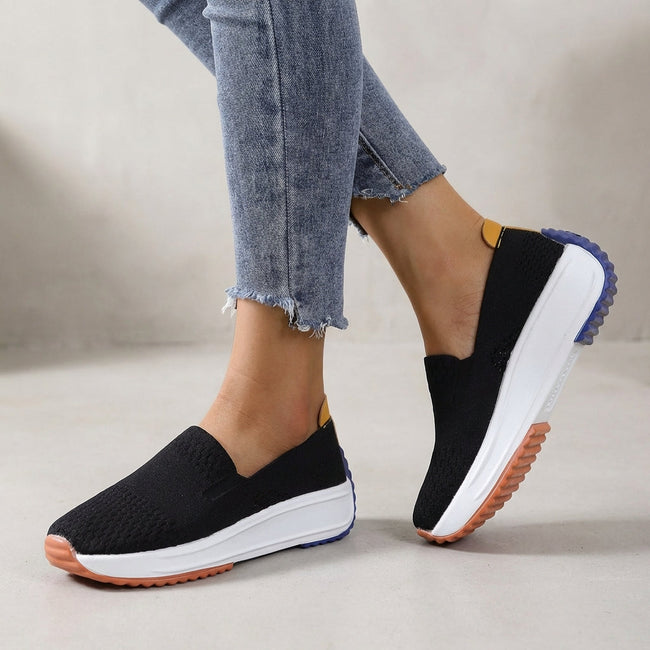 Black FJØRNA women's orthopedic sneakers with knit upper and arch support for comfortable, supportive footwear.