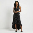 Black elegant maxi dress for women with halter neck and ruffle satin details, by FJØRNA.