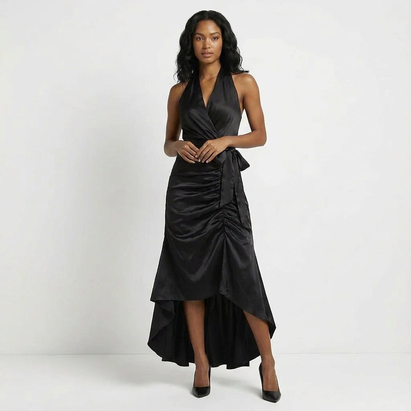 Black elegant maxi dress for women with halter neck and ruffle satin details, by FJØRNA.