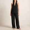 Black FJØRNA women's summer two-piece co-ord set with pockets, V-neck top and lightweight fabric, perfect for casual wear.