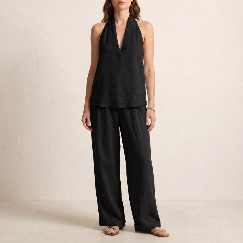 Black FJØRNA women's summer two-piece co-ord set with pockets, V-neck top and lightweight fabric, perfect for casual wear.