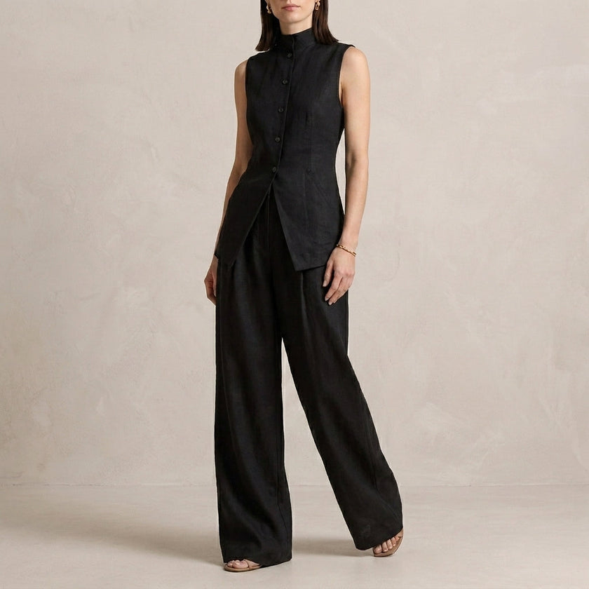 Black FJØRNA women's two-piece co-ord set with asymmetric high neck top and matching pants, stylish and elegant.