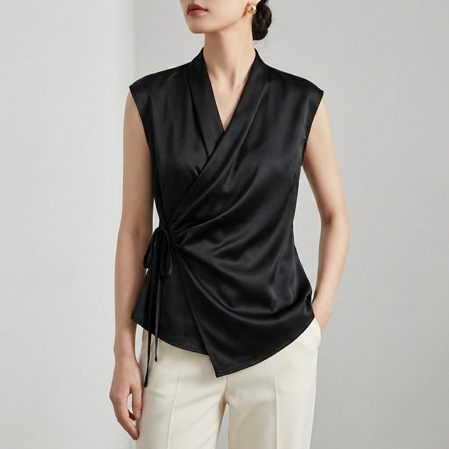Black women's satin summer blouse with V-neck and sleeveless design, stylish top from FJØRNA.
