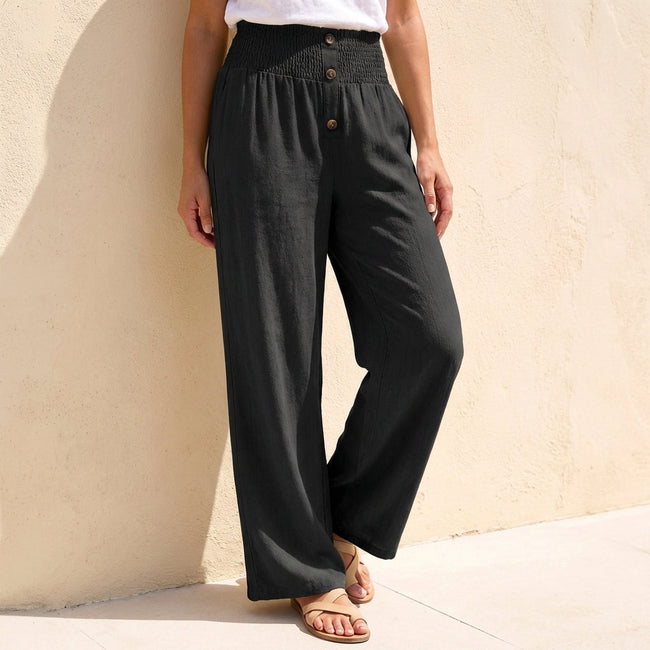 Black linen summer trousers for women with button front, stylish and lightweight from FJØRNA.