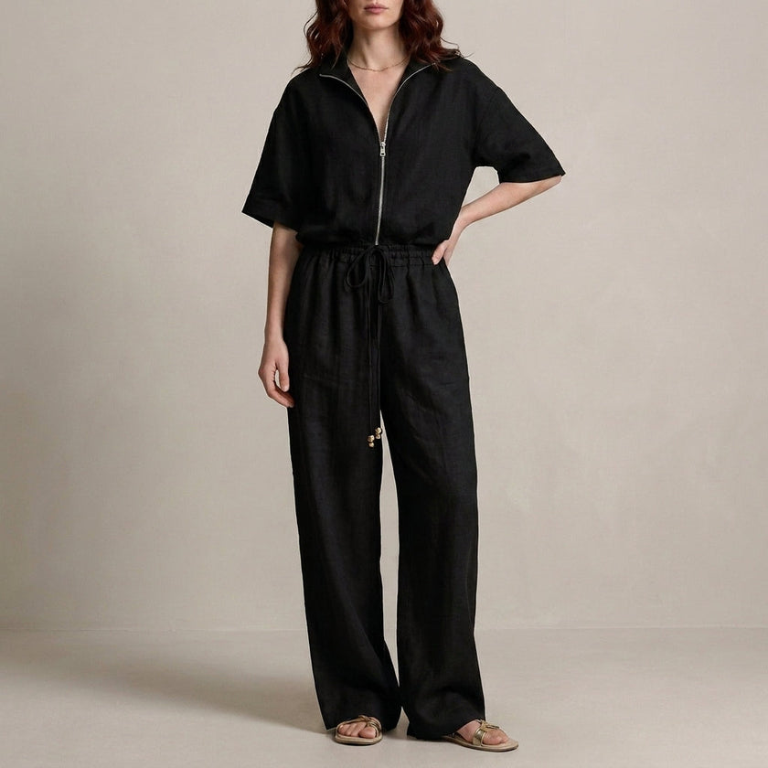 Black FJØRNA two-piece women's co-ord set with drawstring details, featuring a stylish crop top and matching pants.
