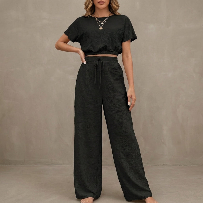 Black FJØRNA women's summer two-piece drawstring co-ord set with lightweight fabric, featuring a matching top and shorts.
