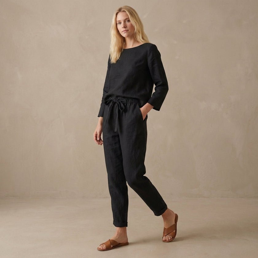 Black linen two-piece women's co-ord set with pockets by FJØRNA, featuring a stylish top and matching pants.