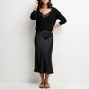 Black satin two-piece women's co-ord set by FJØRNA, flowing and elegant with a stylish, relaxed fit.