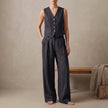 Black linen two-piece pleated co-ord set for women by FJØRNA, featuring elegant and stylish matching top and skirt.