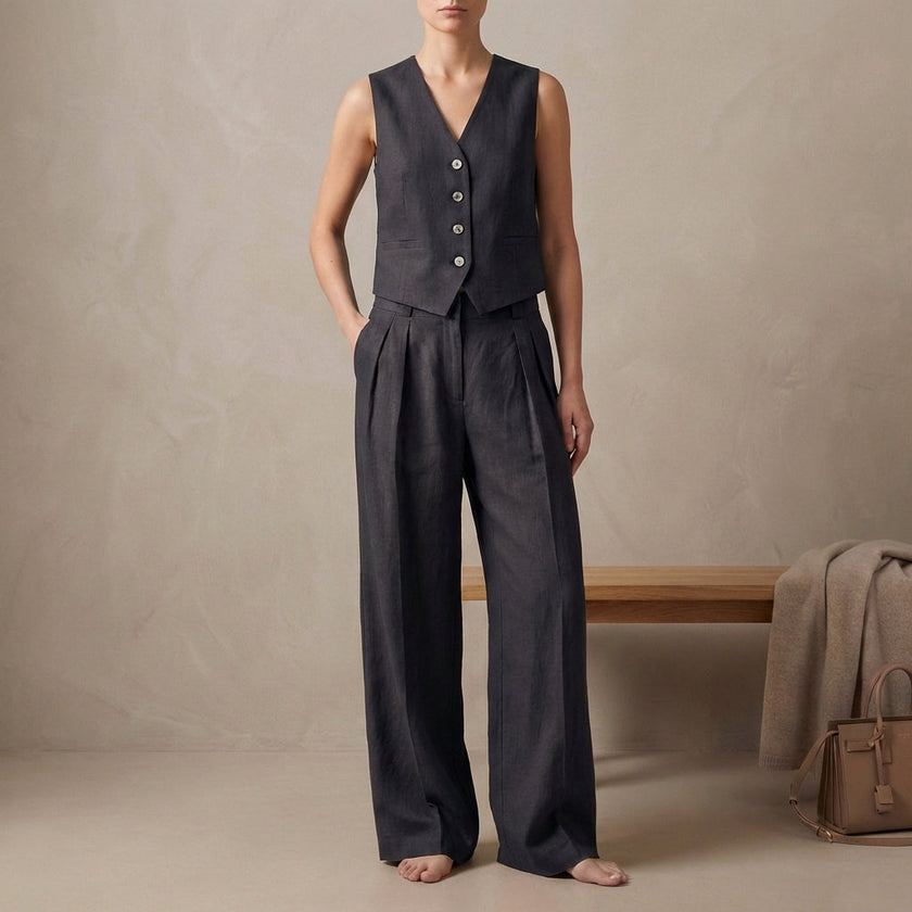 Black linen two-piece pleated co-ord set for women by FJØRNA, featuring elegant and stylish matching top and skirt.