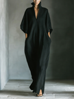 Black cotton maxi dress for women by FJØRNA, flowing long dress with a relaxed fit and sleeveless design.