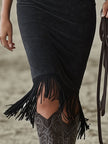 Black faux suede floral midi dress by FJØRNA, featuring a casual style with a fitted bodice and floral pattern.