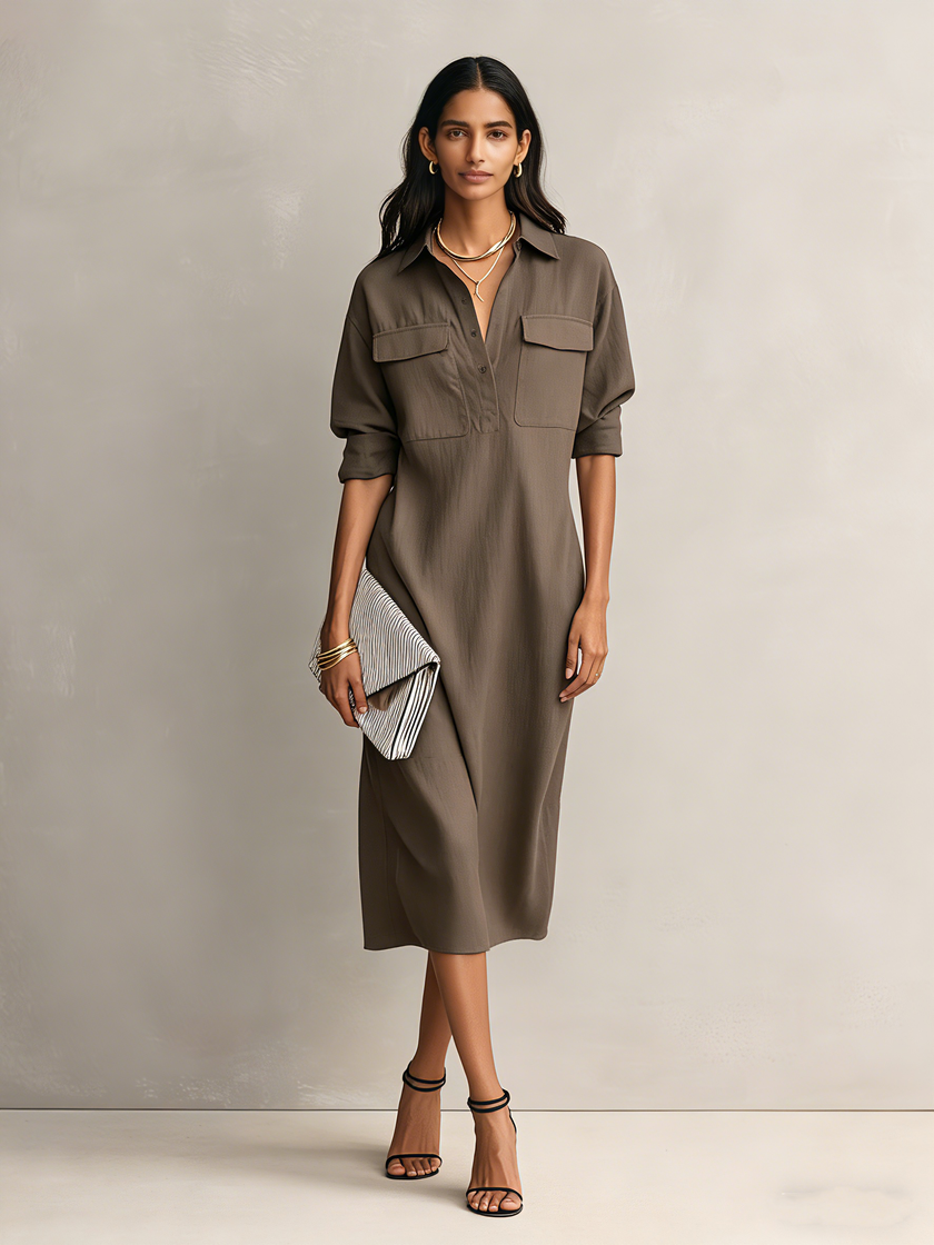Black linen midi dress by FJØRNA, featuring a sleek evening dress design with elegant fabric and a flattering midi length.