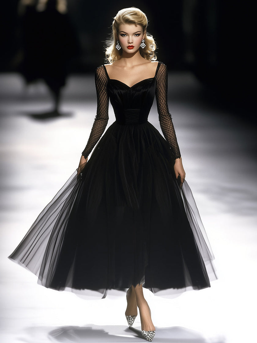 Black maxi dress for women by FJØRNA featuring a flowing silhouette and elegant design for versatile occasion wear.