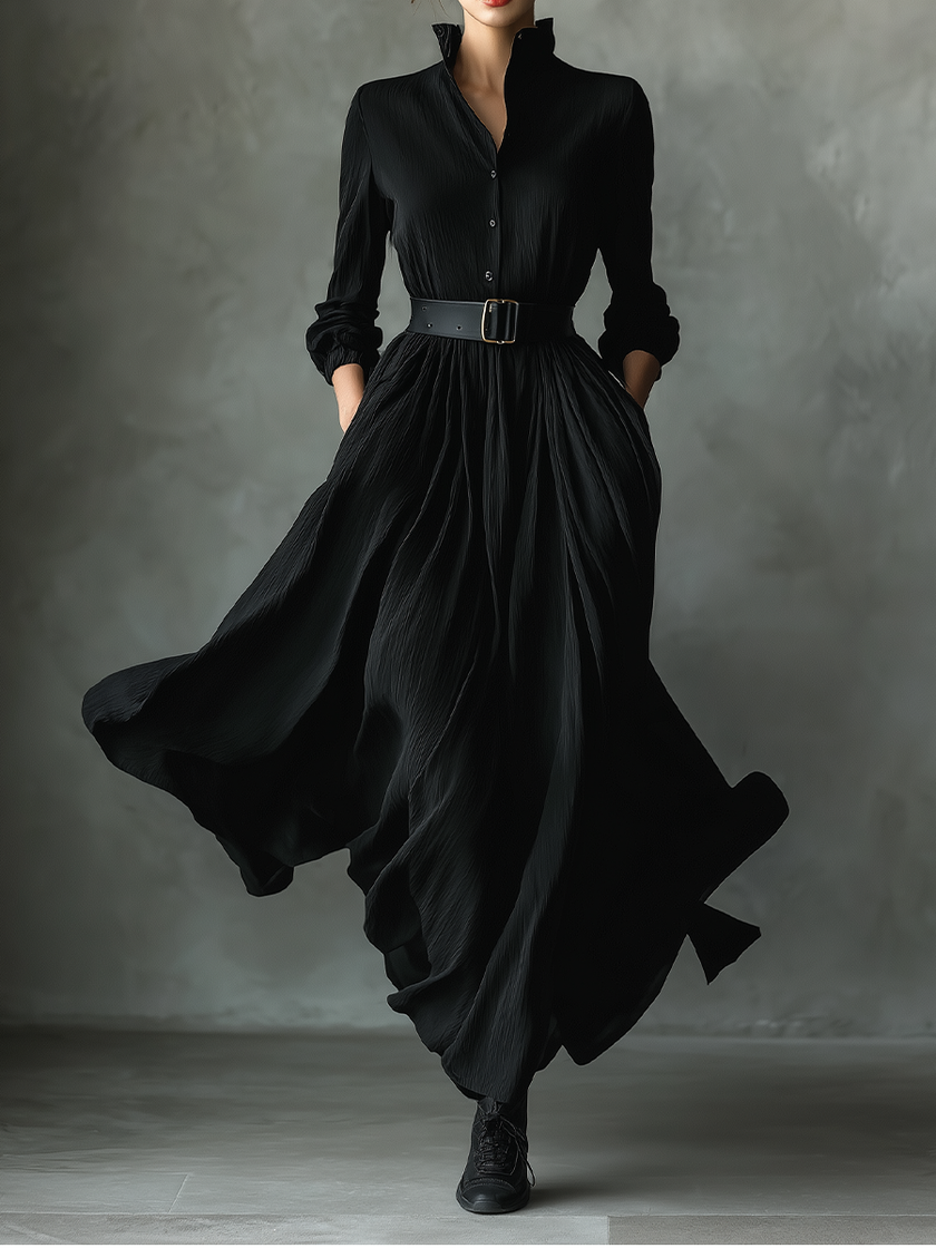 Black pleated maxi dress for women by FJØRNA, flowing fabric, sleeveless design, and elegant pleats visible in the image.