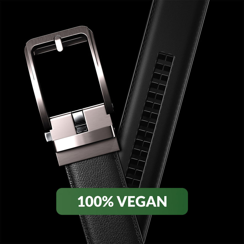 Black vegan leather ratchet belt by FJØRNA, adjustable unisex belt with sleek design and secure buckle for versatile style.