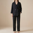 Black women's blazer by FJØRNA featuring a lightweight design and drawstring waist, suitable for casual or stylish wear.