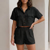 Black women's summer two-piece co-ord set by FJØRNA with a button-front top and matching shorts, stylish and breathable for warm weather.