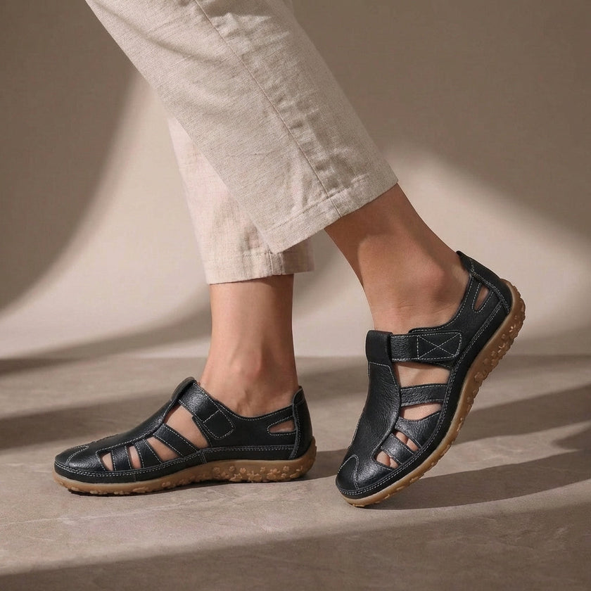 Black FJØRNA orthopedic cutout fisherman sandals for women, showcasing adjustable straps and supportive design.