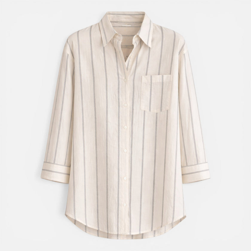 Women's striped button-down shirt by FJØRNA, relaxed fit, lightweight blouse with blue and white stripes.