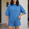 Blue striped women's two-piece summer co-ord set with twist front design by FJØRNA, featuring a cropped top and matching skirt.