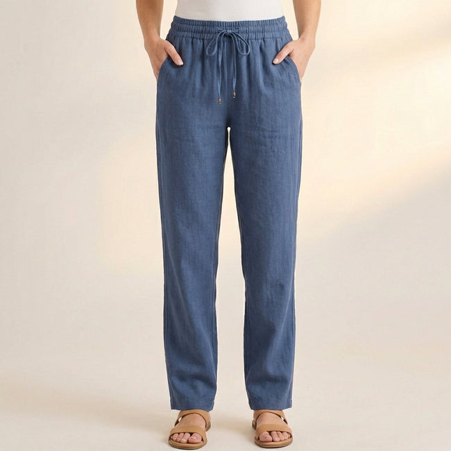 Blue FJØRNA women's summer linen trousers with pockets, lightweight and comfortable for warm weather wear.