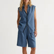 Blue women's summer two-piece pleated co-ord set by FJØRNA, lightweight matching top and skirt ensemble.