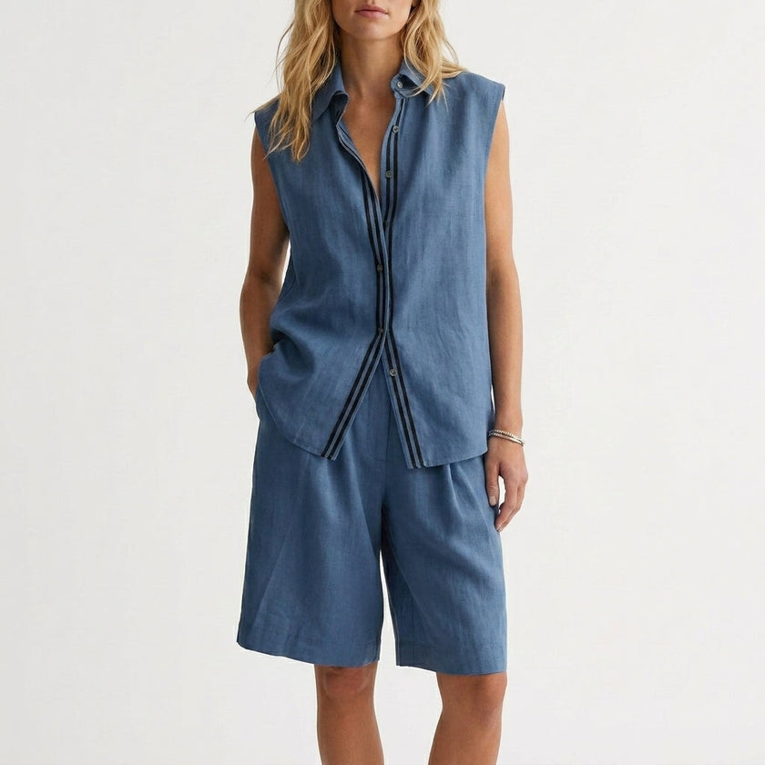 Blue women's summer two-piece pleated co-ord set by FJØRNA, lightweight matching top and skirt ensemble.