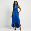 Blue FJØRNA elegant maxi dress for women with halter neck and ruffle satin fabric, showcasing a flowing, stylish design.