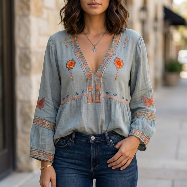 Blue floral V-neck summer blouse for women by FJØRNA, flowy and stylish top perfect for warm weather.